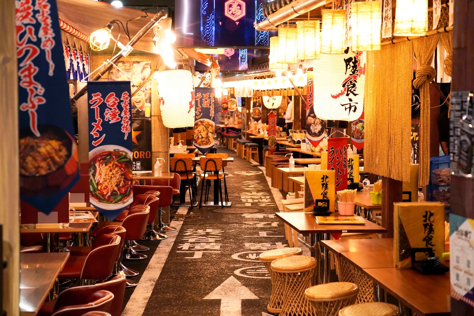The lantern-lit interior of the Shibuya Yokocho food alley.