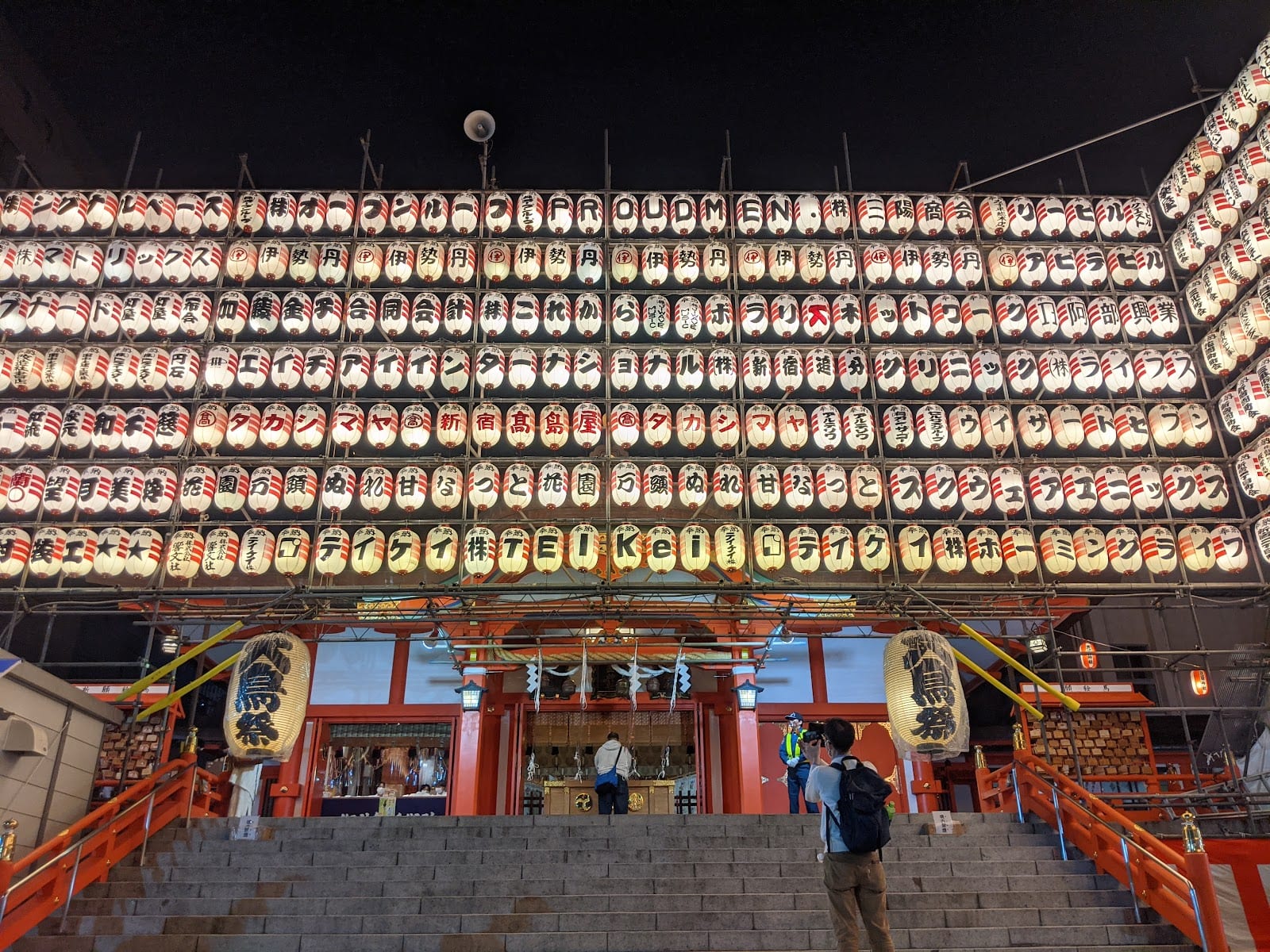 Rows of golden lanterns strung at Hanazono Shrine.