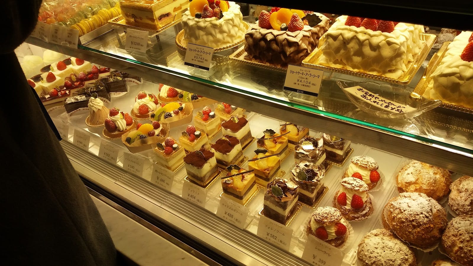Rows of cakes and pastries in the Isetan Shinjuku food hall.