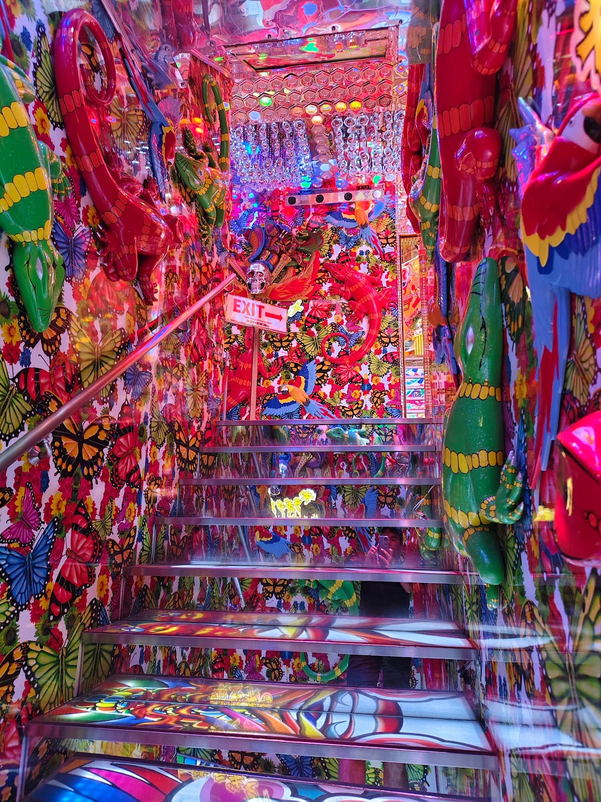 The mirrored, neon-bright staircase inside the Samurai Restaurant.
