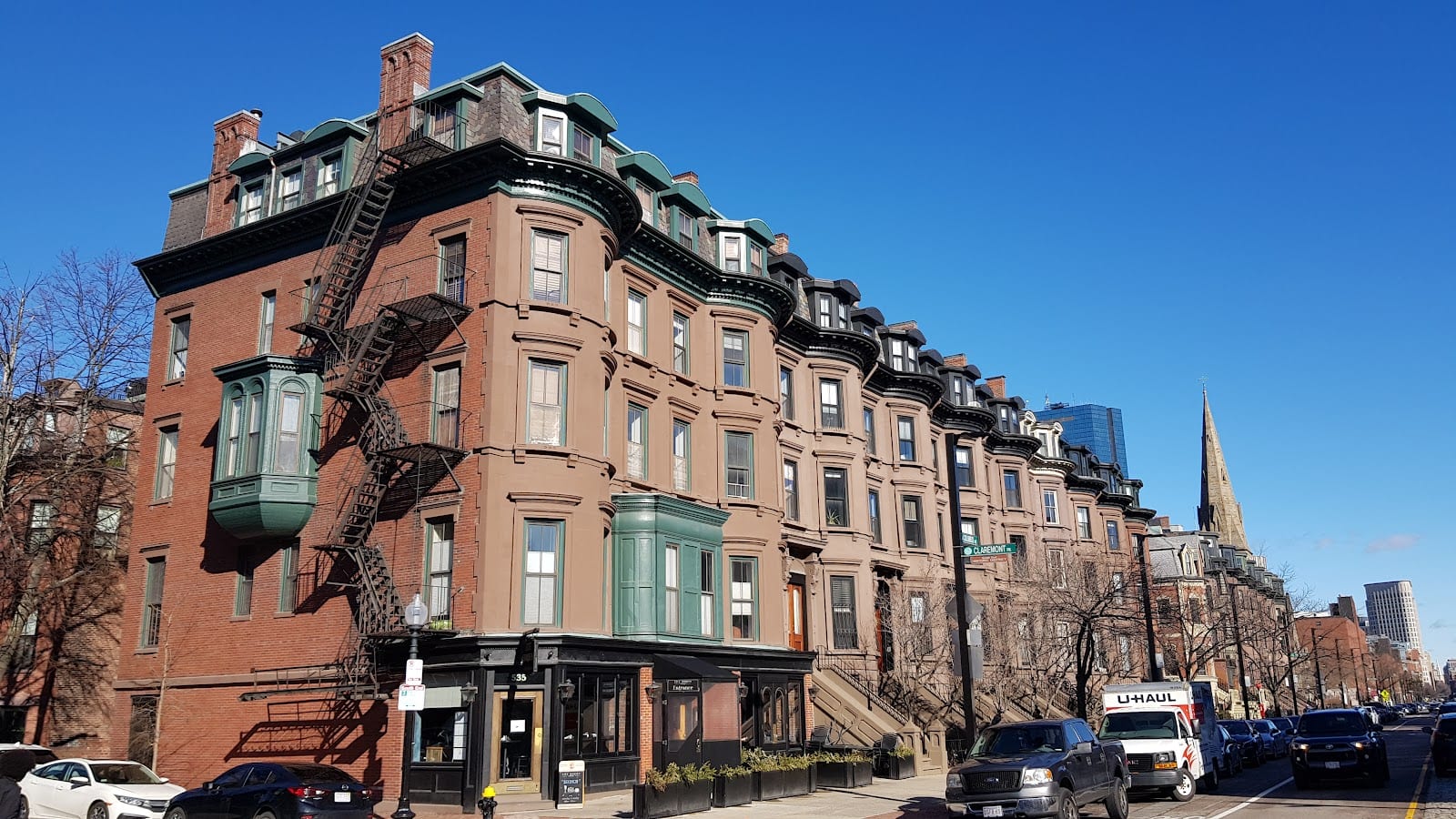 Victorian storefronts and restaurant patios on Tremont Street, South End Boston.