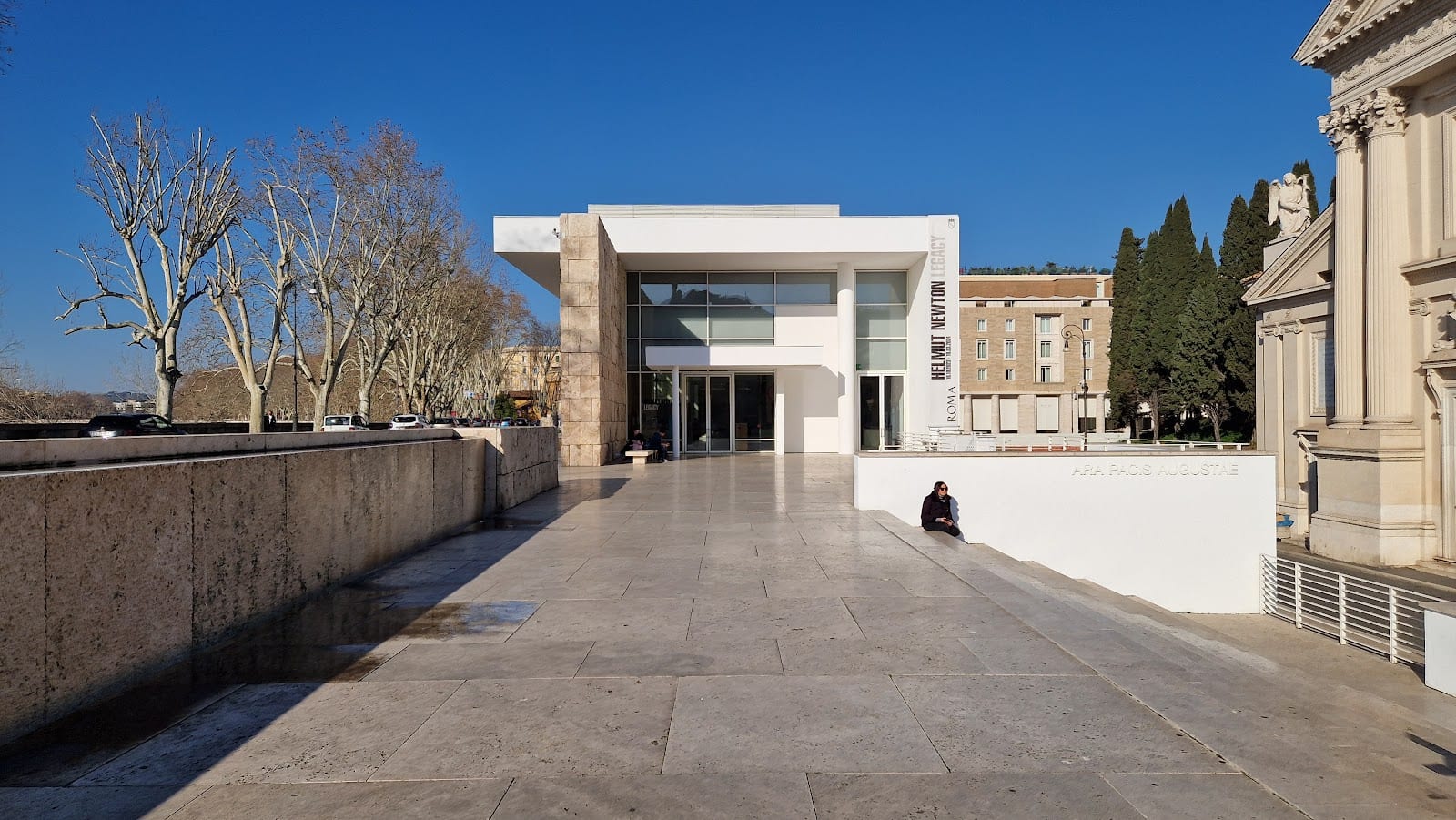 The modern white exterior of the Ara Pacis Museum by Richard Meier.
