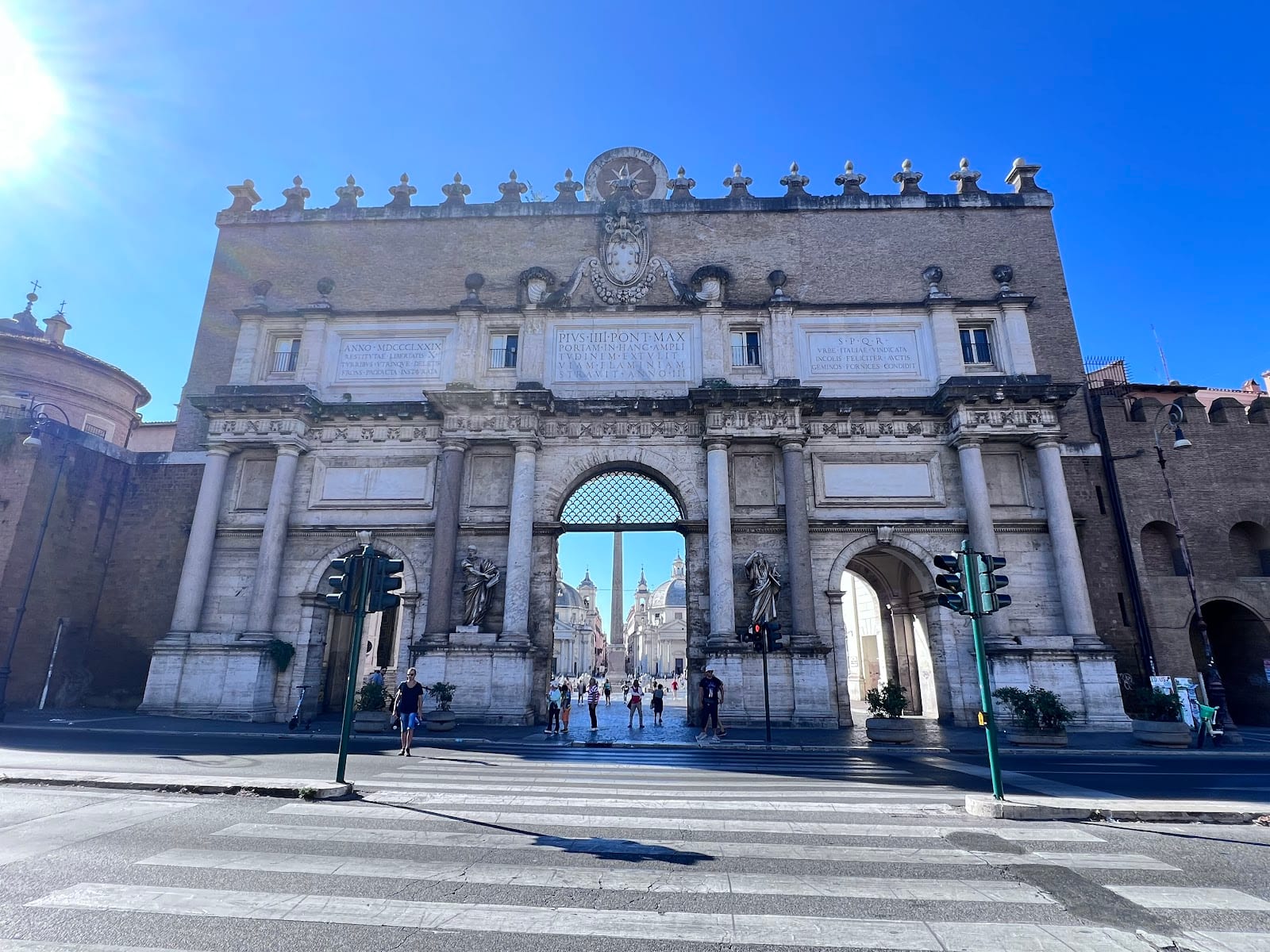 The Porta del Popolo gate on the northern side of the square.