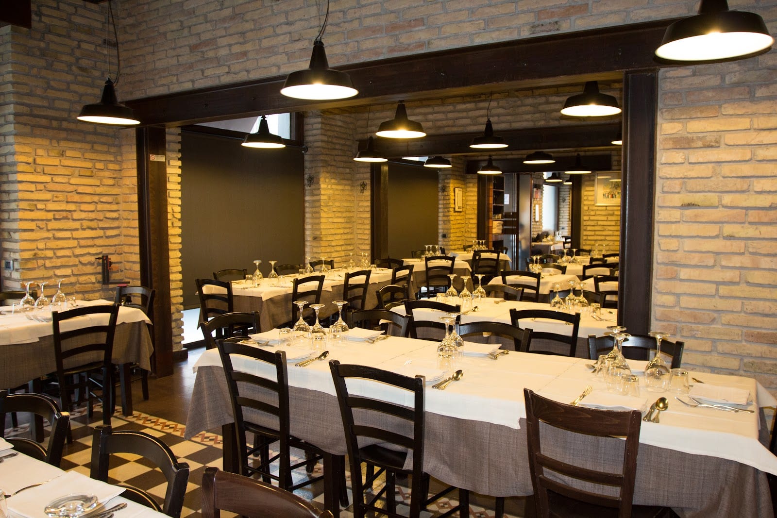The brick-walled dining room of Felice a Testaccio.