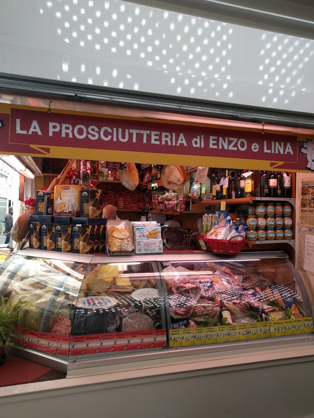 The Prosciutteria di Enzo e Lina cured-meats stall in the Testaccio market.