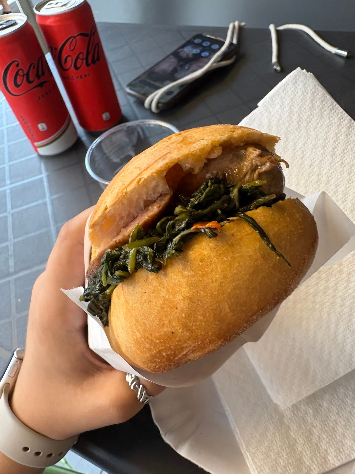 A crusty panino stuffed with braised beef and greens at Mordi e Vai.
