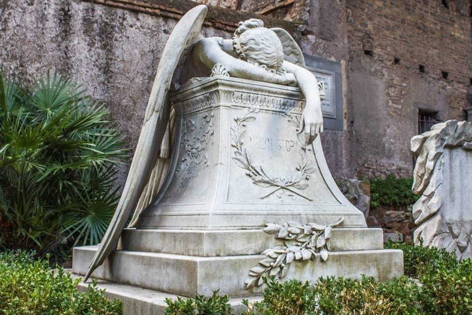 The Angel of Grief sculpture weeping over a tomb in the Non-Catholic Cemetery.