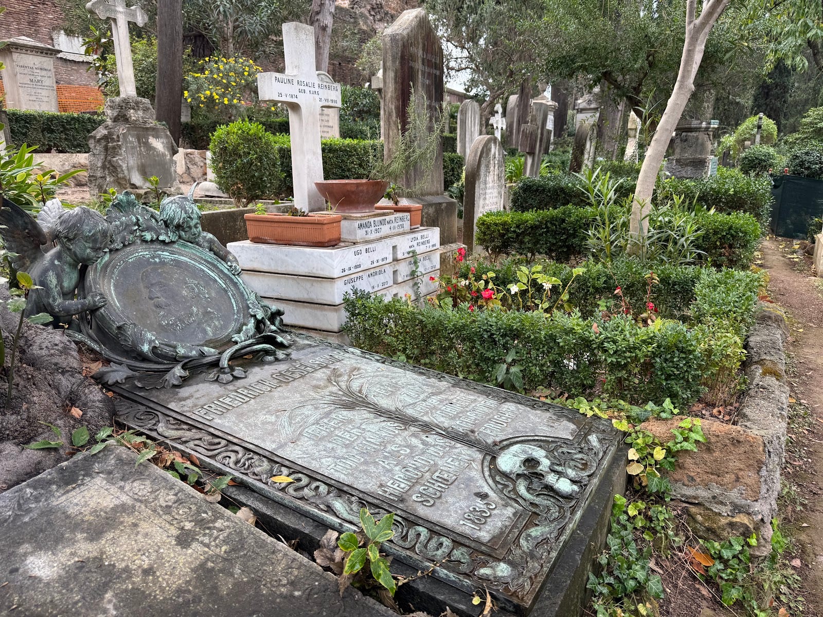 Graves and flowers in a quiet corner of the Non-Catholic Cemetery in Rome.