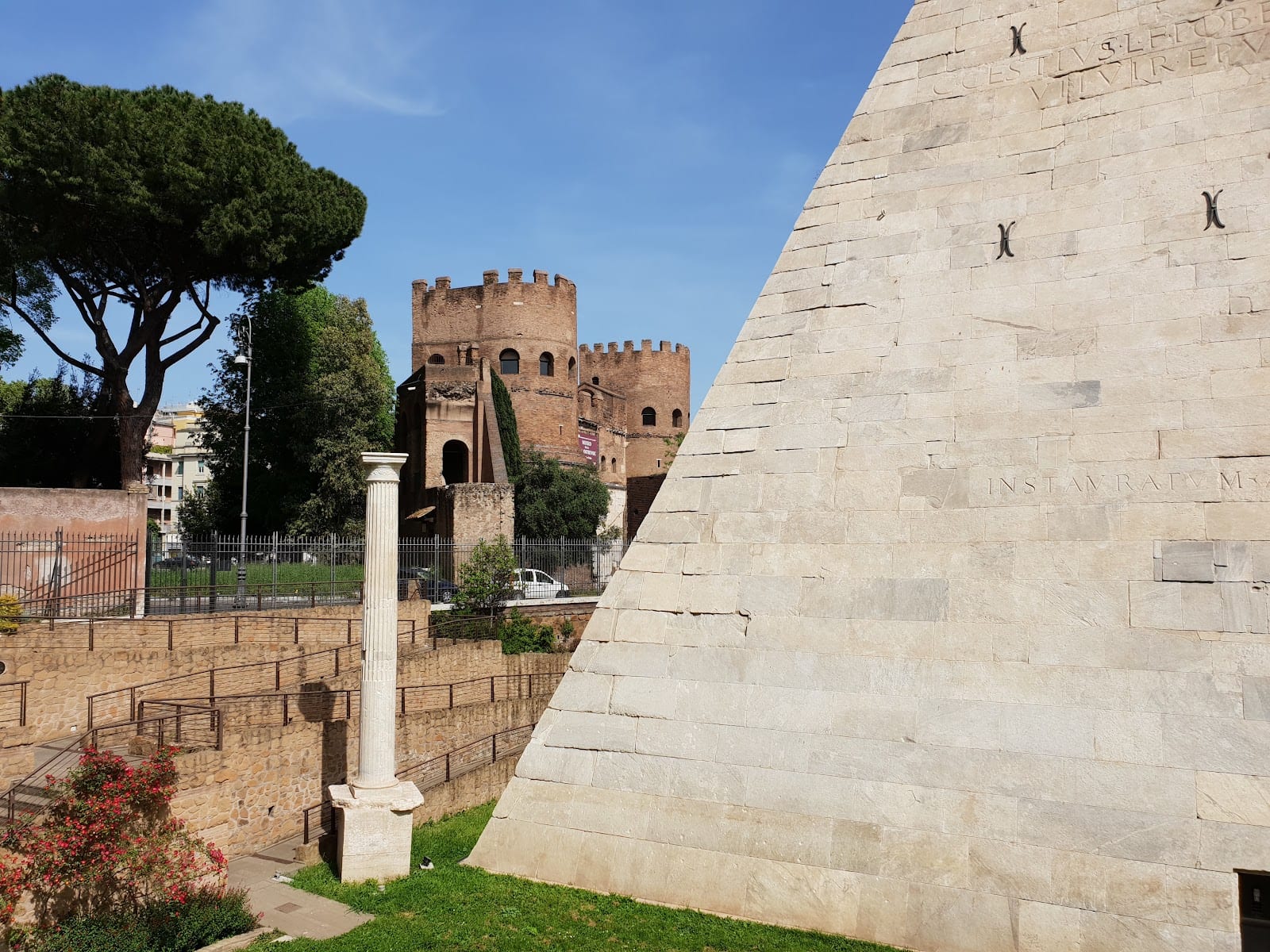 The Pyramid of Cestius beside the medieval Porta San Paolo gate in Rome.