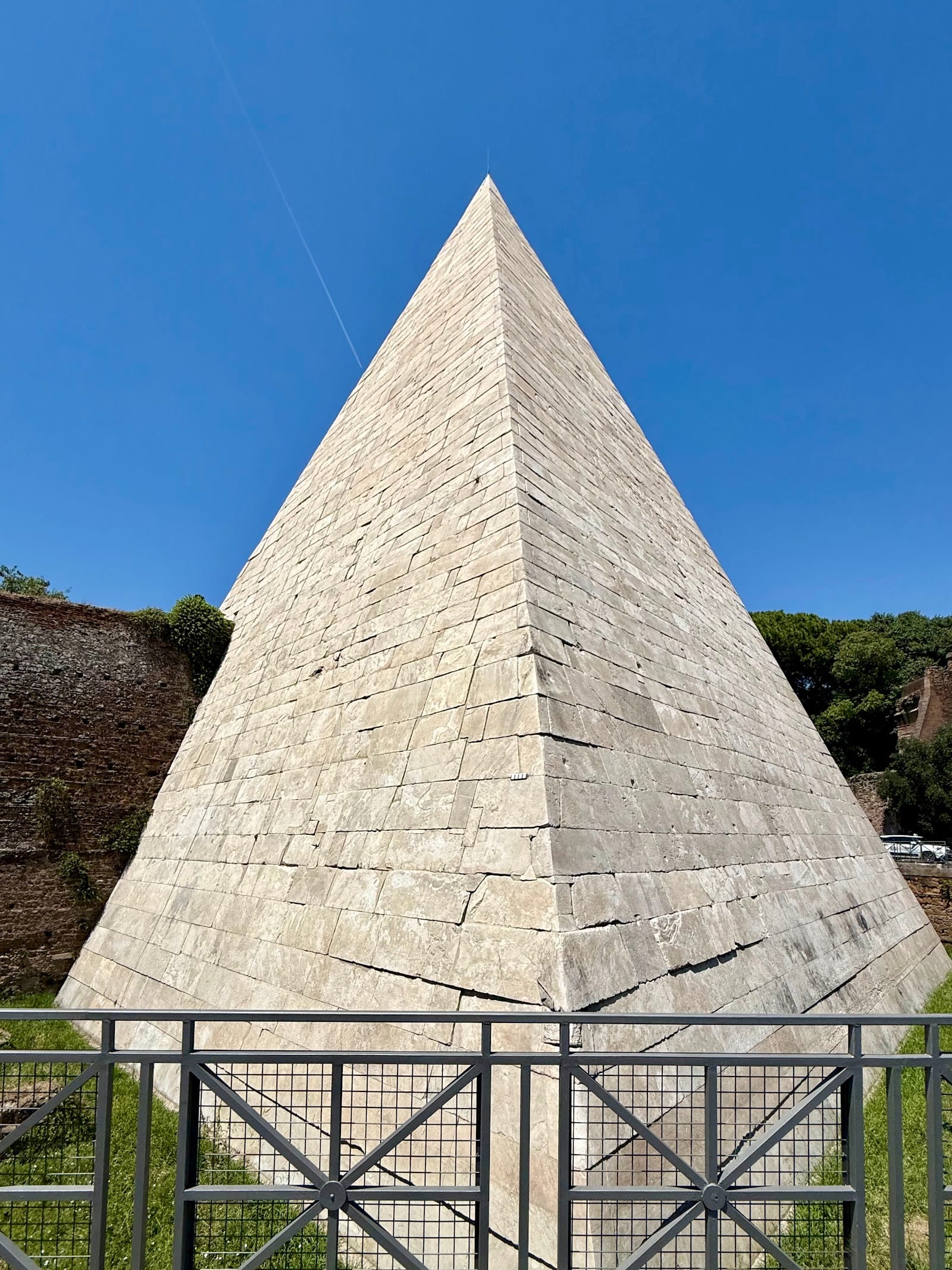The marble-faced Pyramid of Cestius rising above the umbrella pines at the edge of Testaccio, Rome.