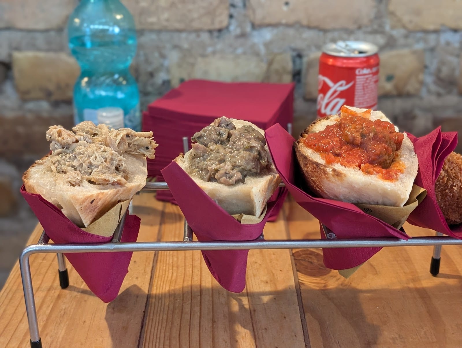 A rack of trapizzini stuffed with different Roman fillings.