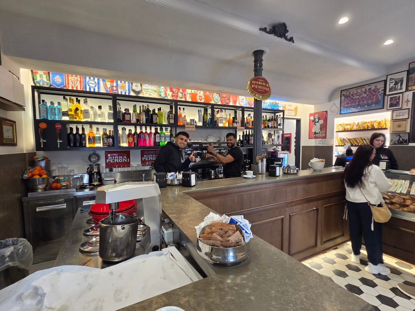 The bar counter and baristas at Bar San Calisto.