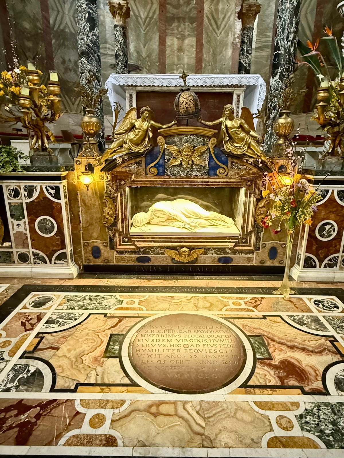 Stefano Maderno's 1600 marble statue of Saint Cecilia beneath the altar.
