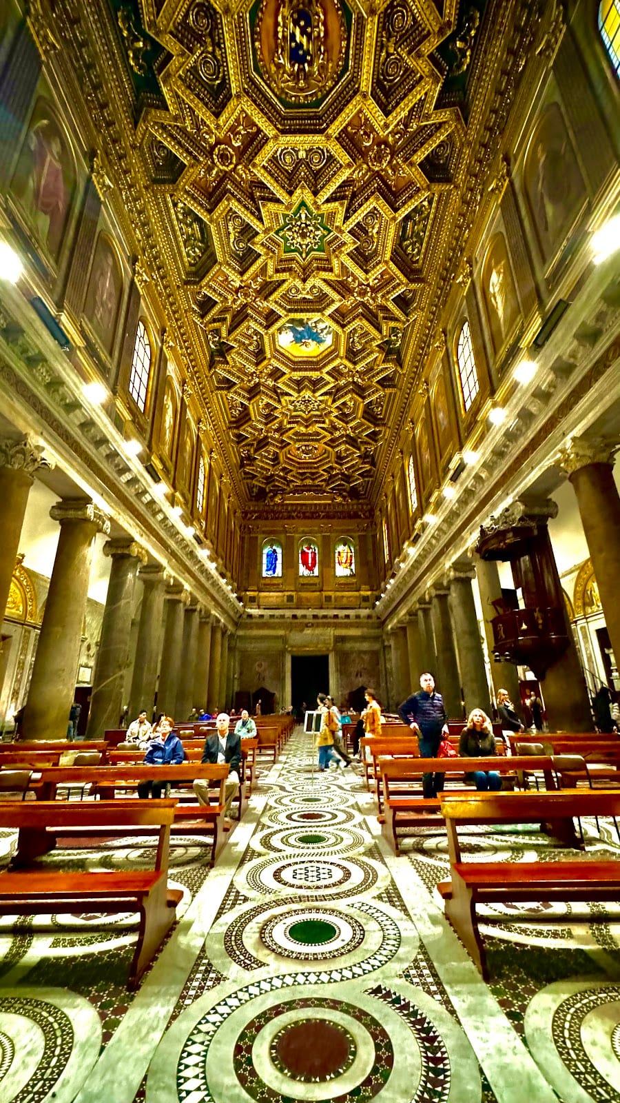 The gilded coffered ceiling and nave of Santa Maria in Trastevere.