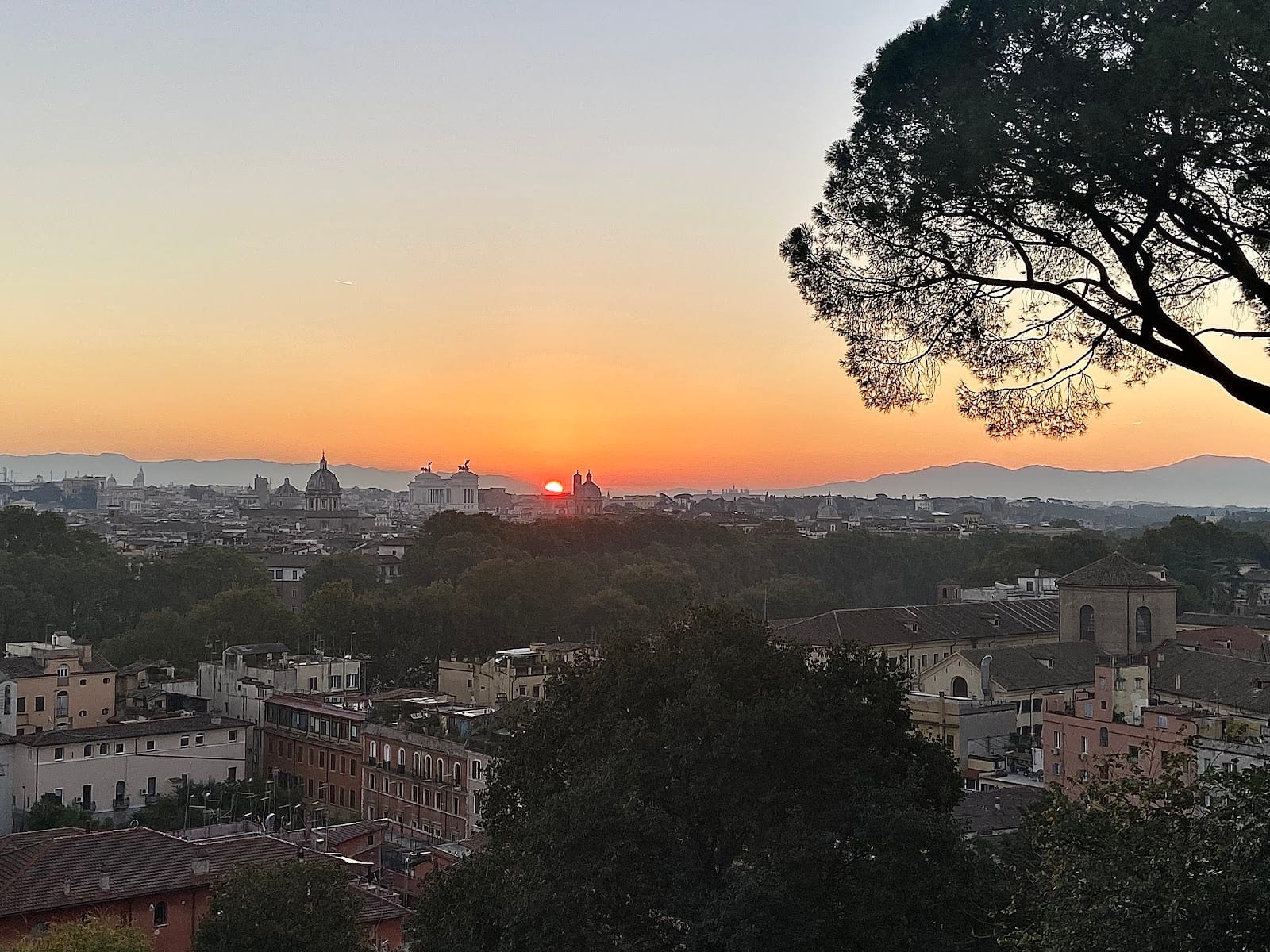 Sunset over Rome's domes and rooftops from the Gianicolo terrace.