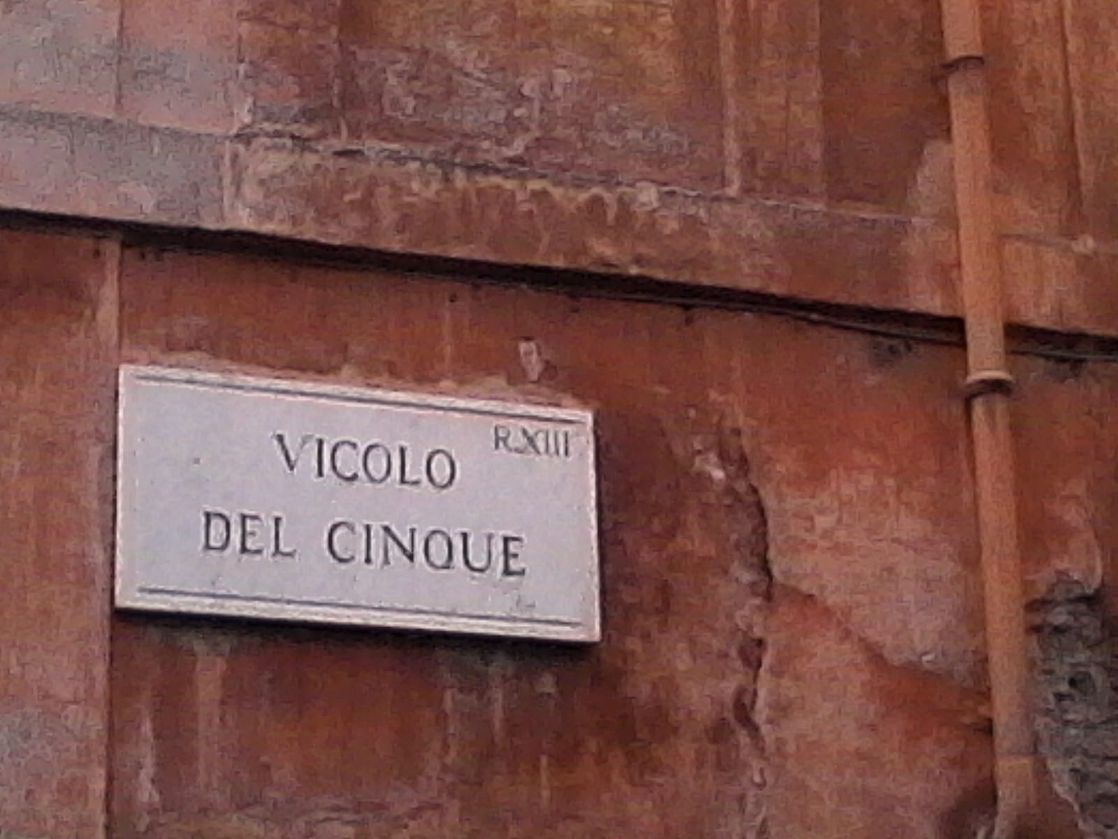 The Vicolo del Cinque street sign in Trastevere.