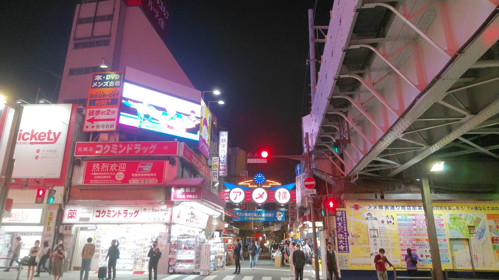 Neon shopfronts and evening crowds along Ameyoko.