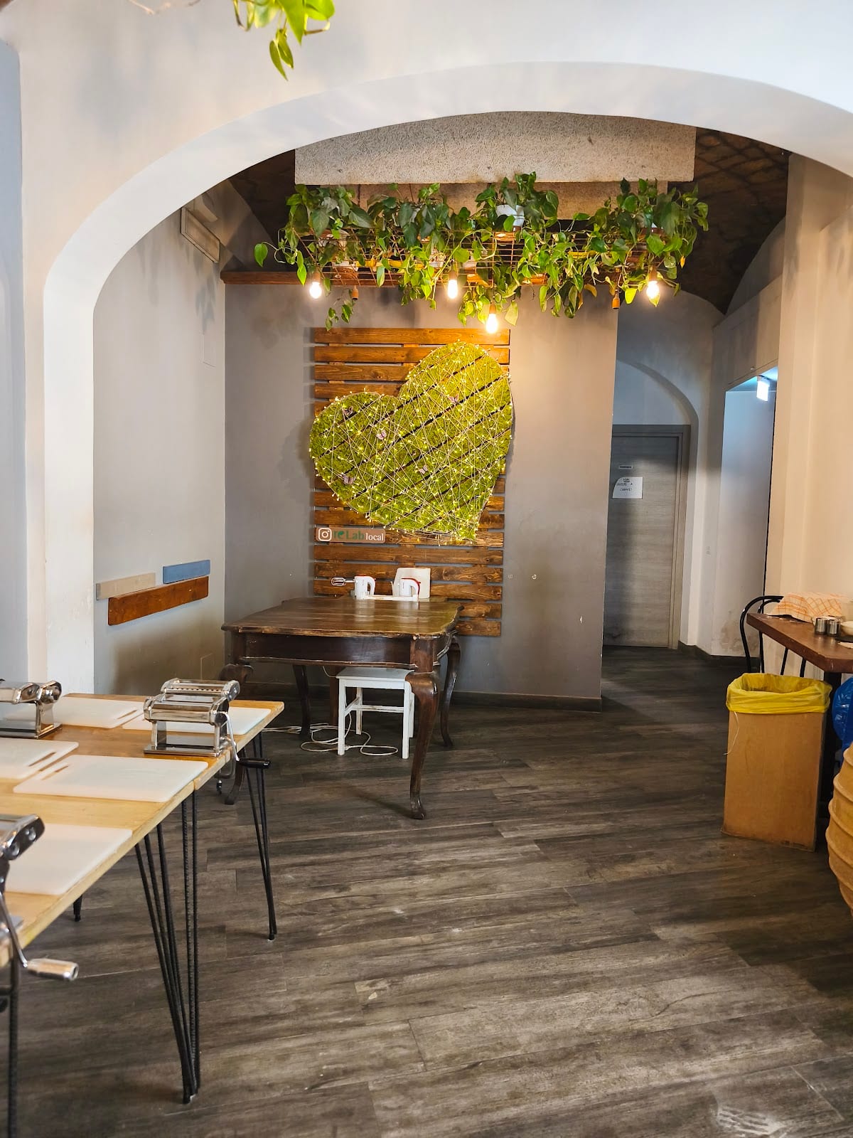 The interior of Fa-Bio (reLab) with its green living-plant heart on the wall.