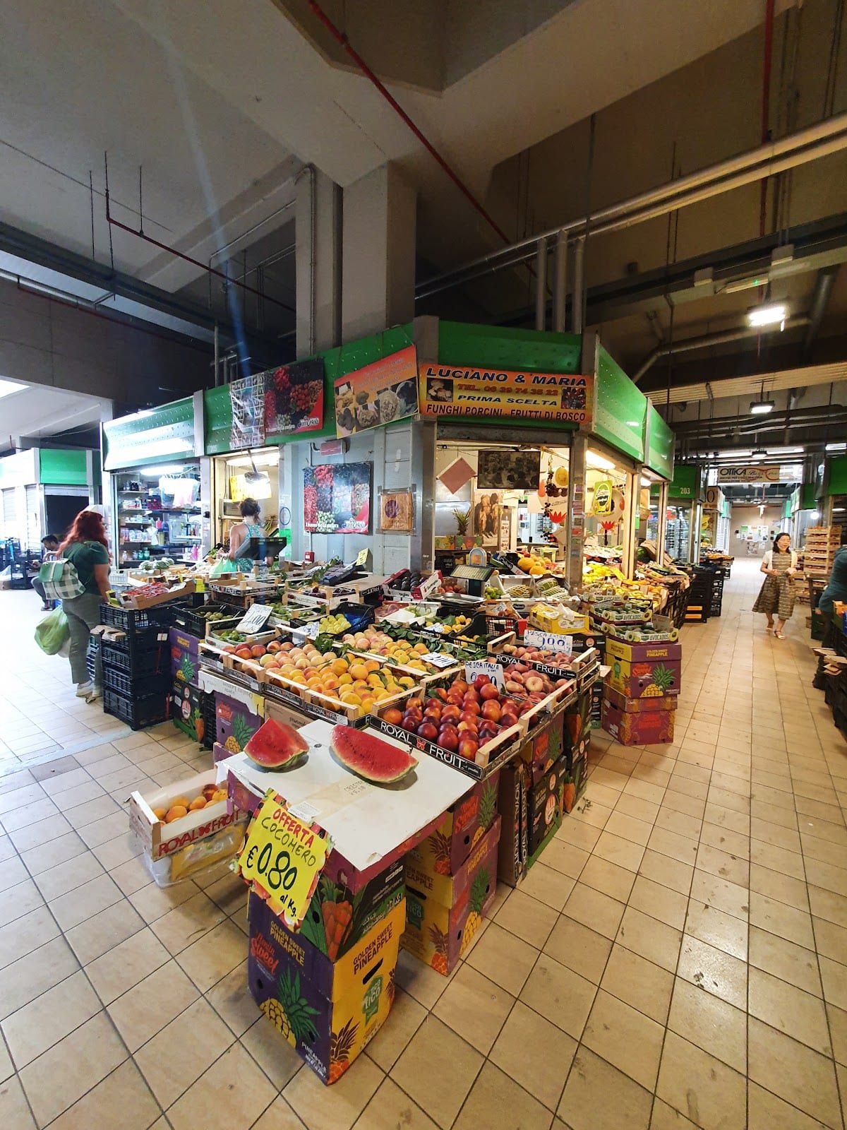 Produce stalls along an aisle of the Mercato Trionfale.