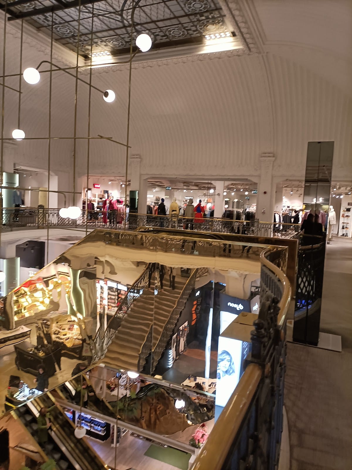 The bright interior of the COIN Excelsior store on Via Cola di Rienzo.