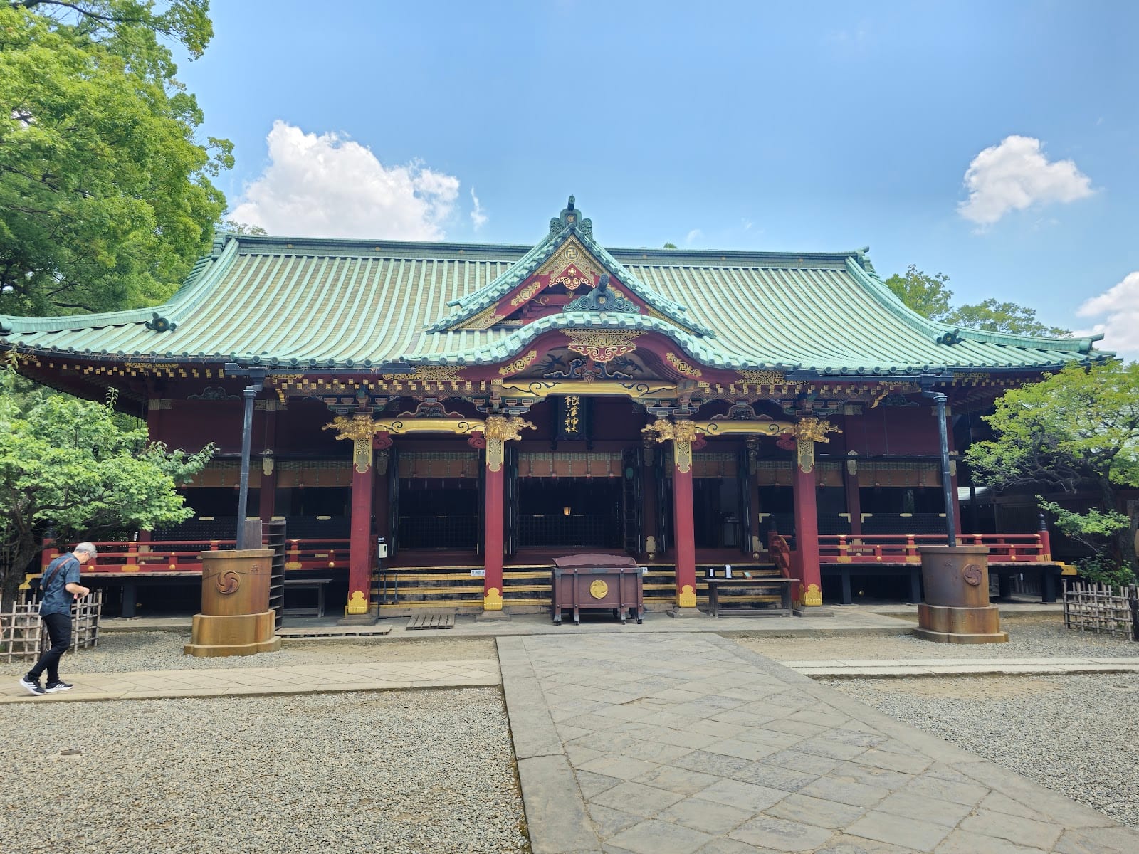The ornate vermilion main hall of Nezu Shrine.