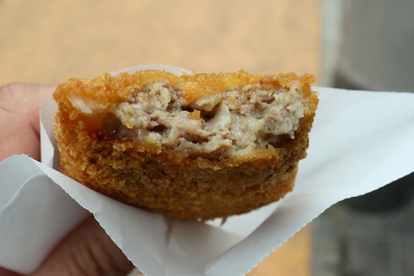A freshly fried menchi-katsu from Niku no Suzuki.