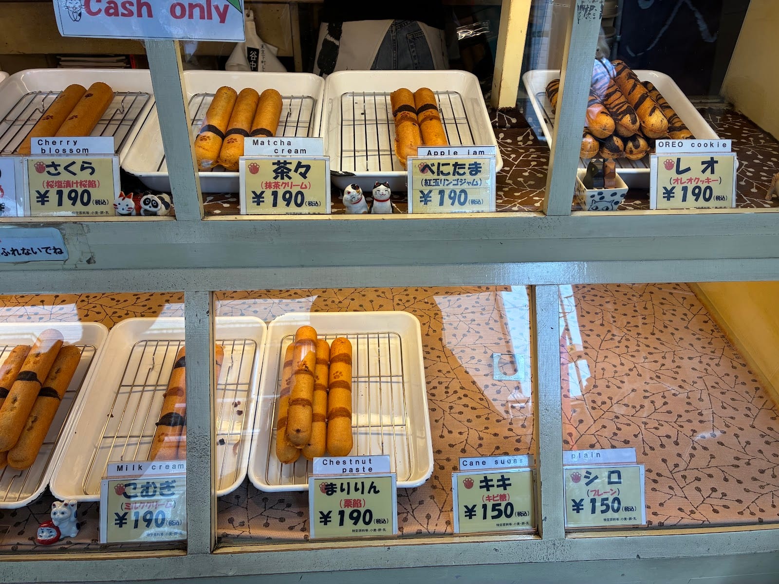 The display of cat-tail doughnuts in their flavours at Yanaka Shippoya.