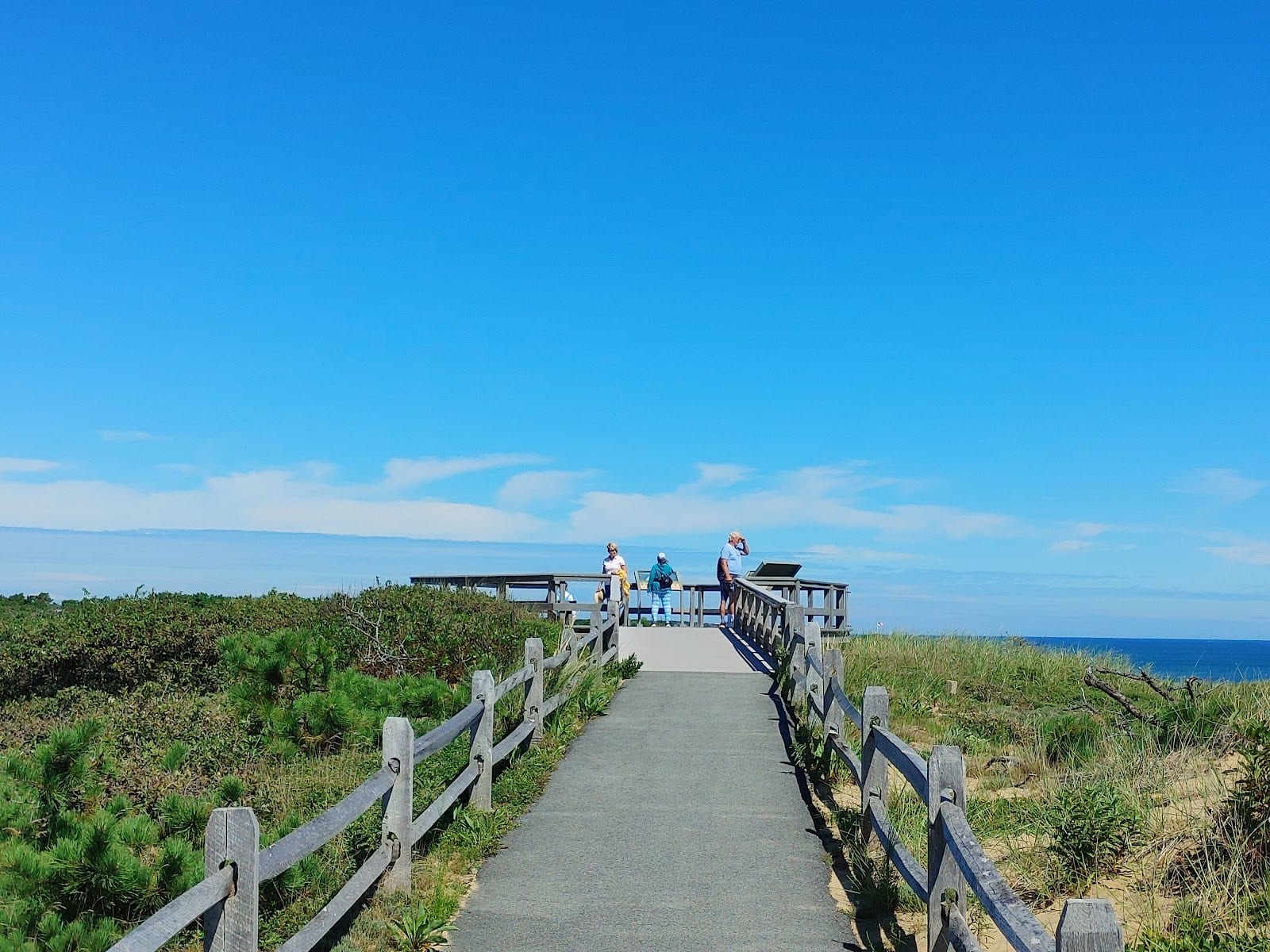 A boardwalk path through dune grass to the beach at Marconi Beach.