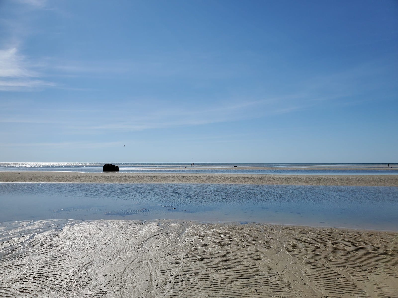 The calm shallow water and low-tide flats of Skaket Beach in Orleans.