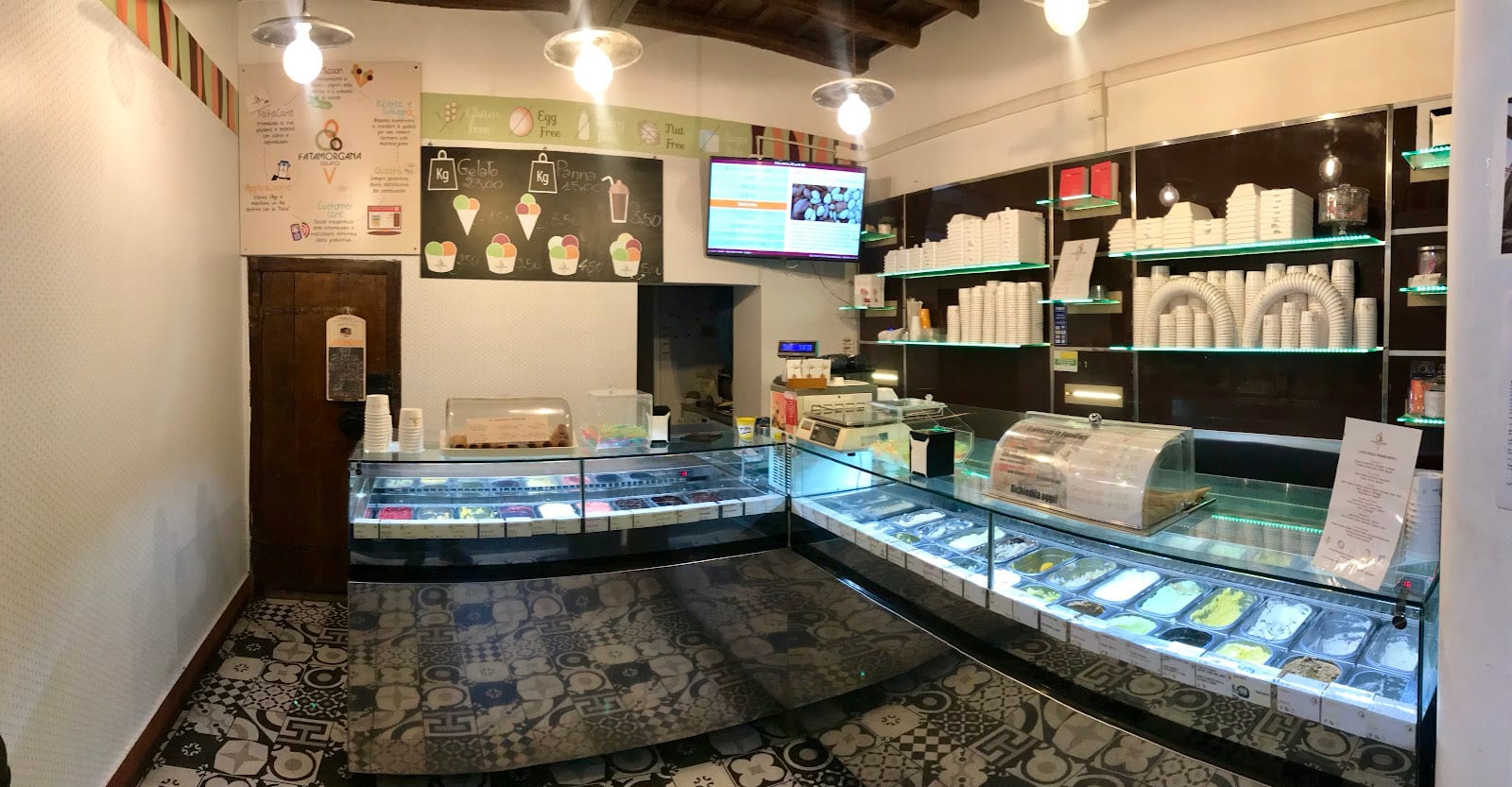 The interior of Fatamorgana, its gelato stored in covered metal tins.