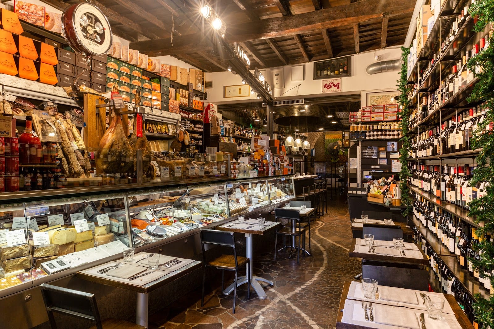 The cured-meat and wine-lined interior of Roscioli Salumeria con Cucina near Campo de' Fiori.
