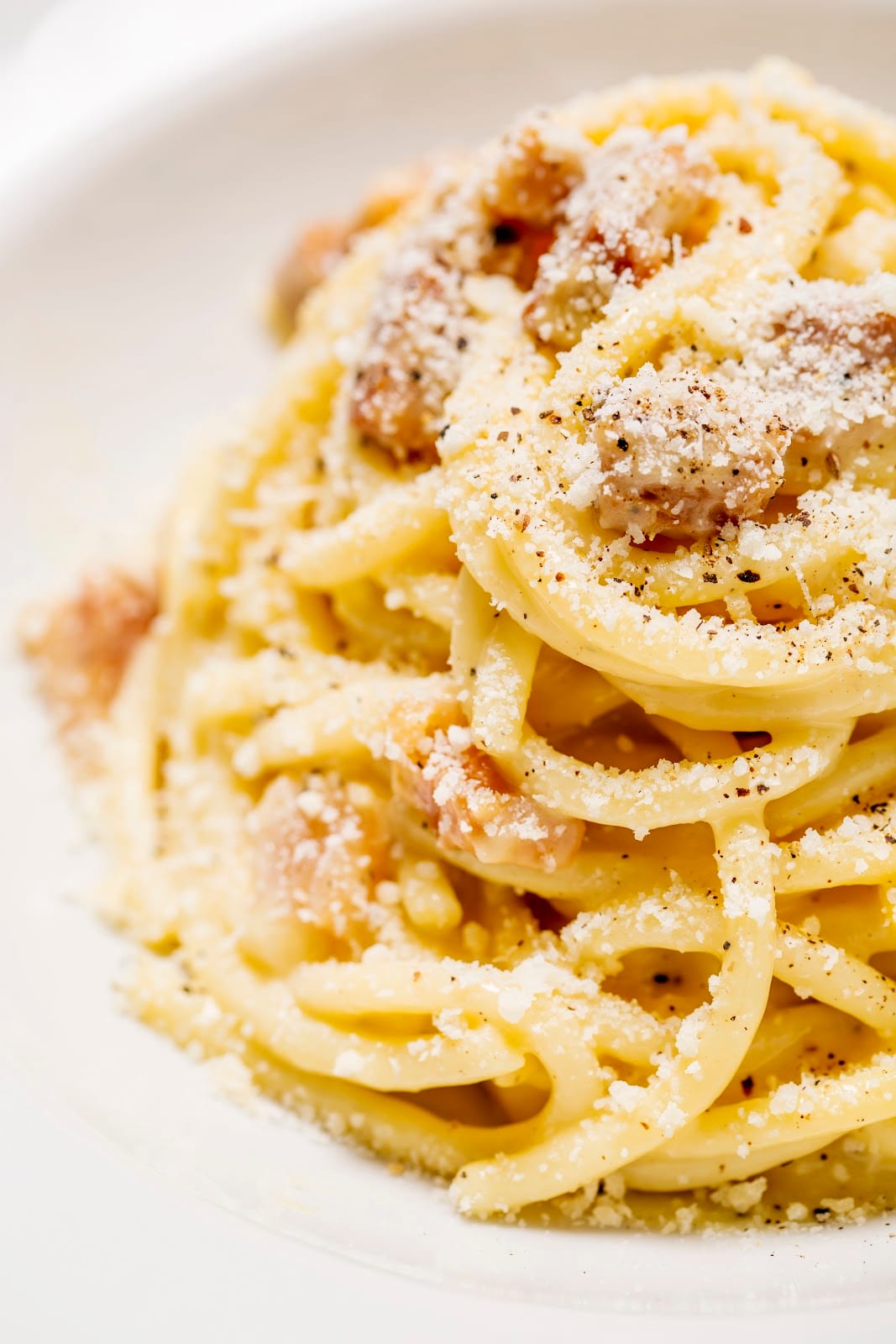 A bowl of spaghetti carbonara at Roscioli, glossy with egg yolk, pecorino and crisp guanciale.