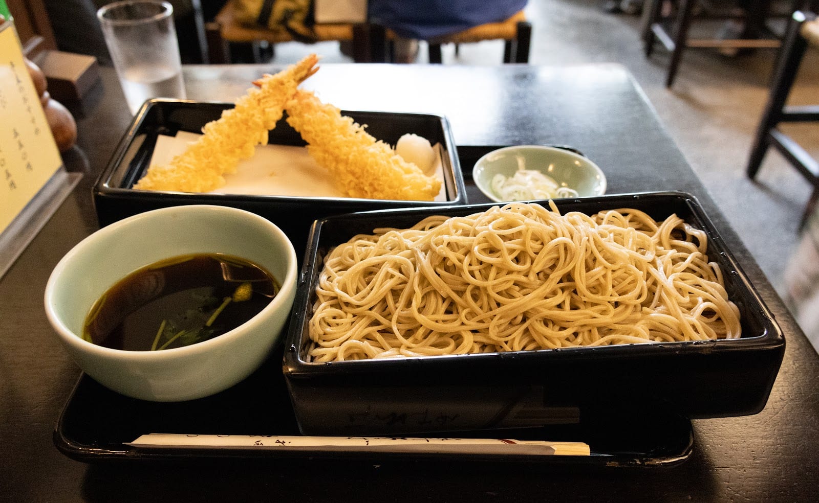 A soba set with tempura and a cup of dipping broth at Kanda Matsuya.