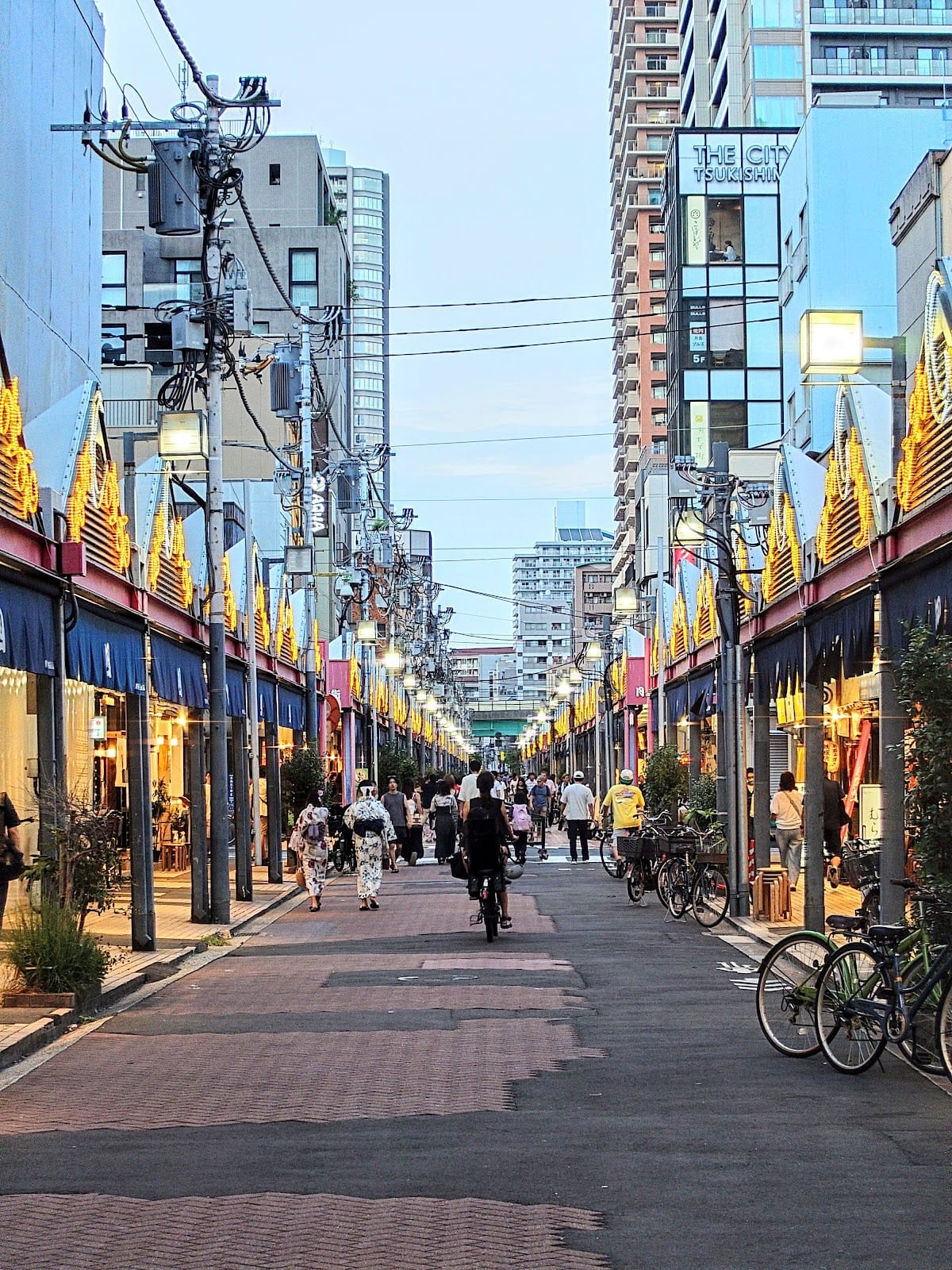 The lantern-strung Monja Street in Tsukishima, lined with monjayaki shops.