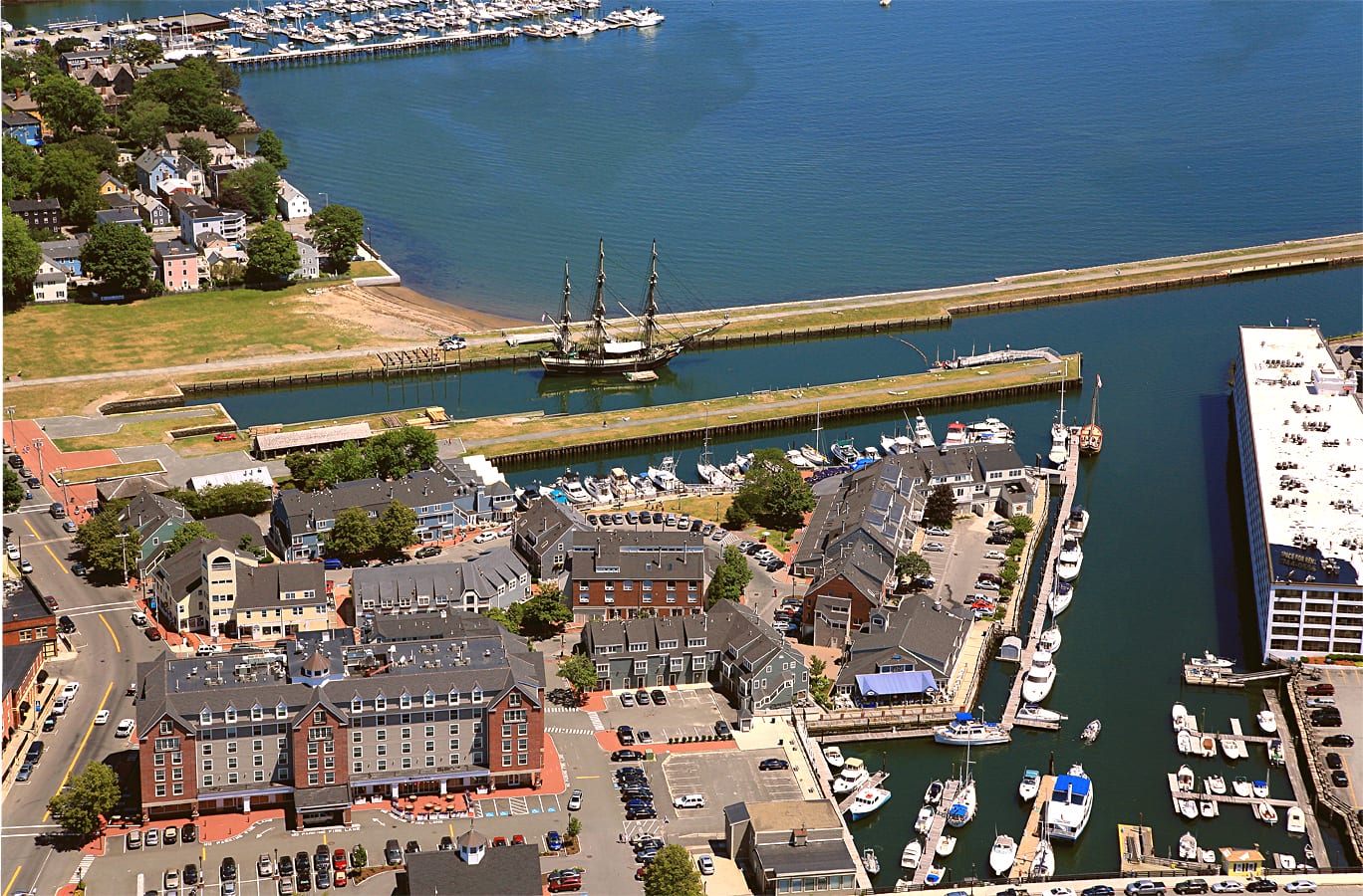 Salem waterfront with historic brick buildings and boats at dock.