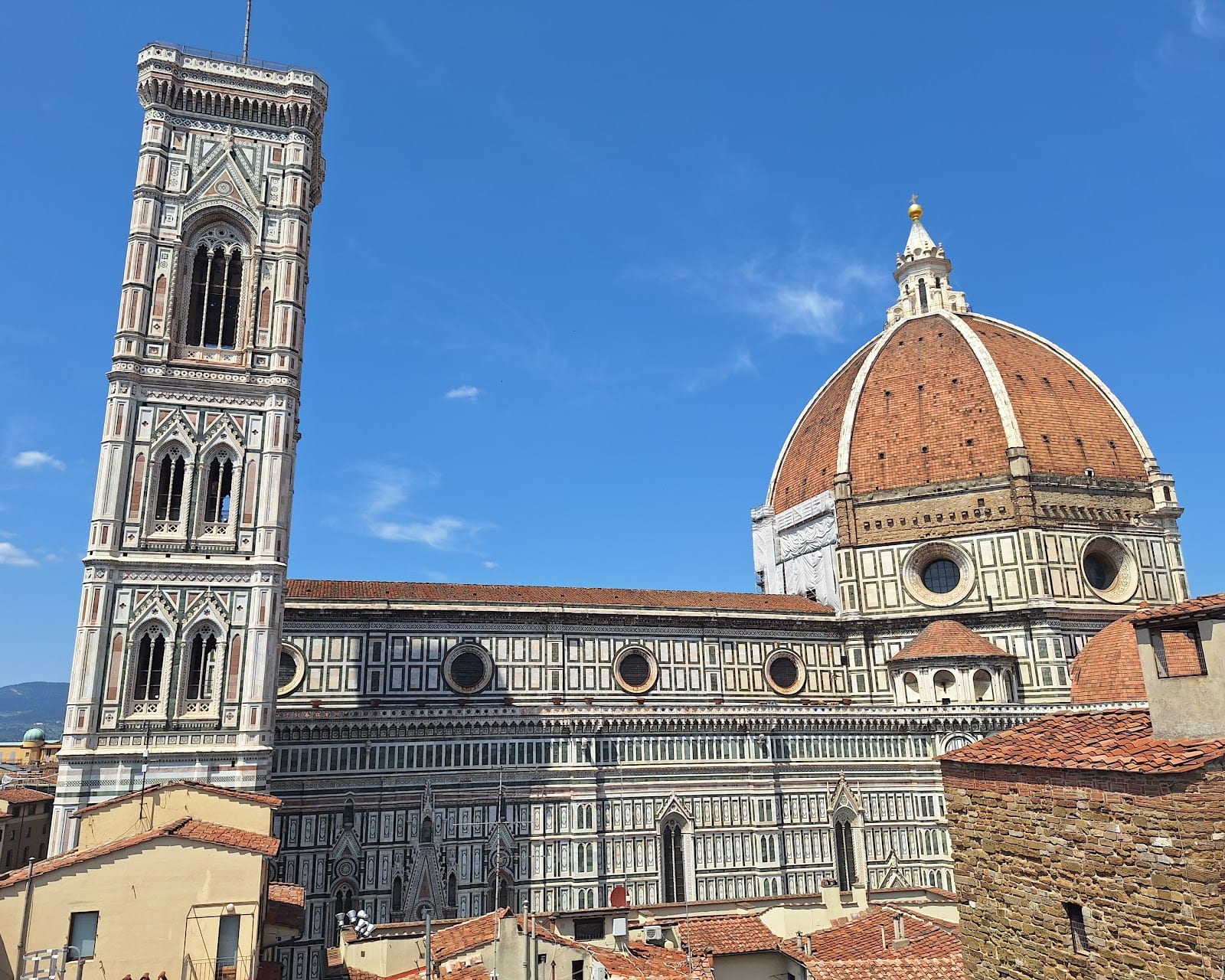 Florence Cathedral's dome and striped campanile rising over the city.
