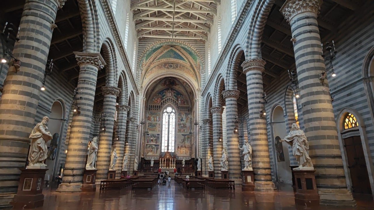 The black-and-white striped nave of Orvieto Cathedral.
