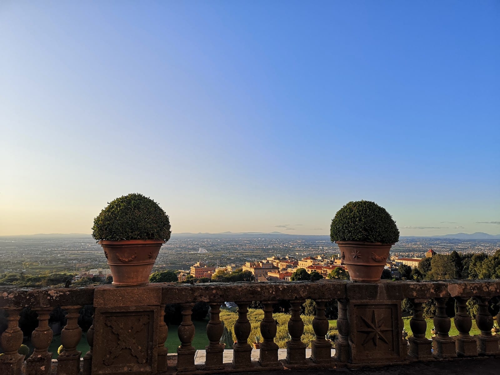 A balustraded terrace at Frascati looking out over the countryside toward Rome.