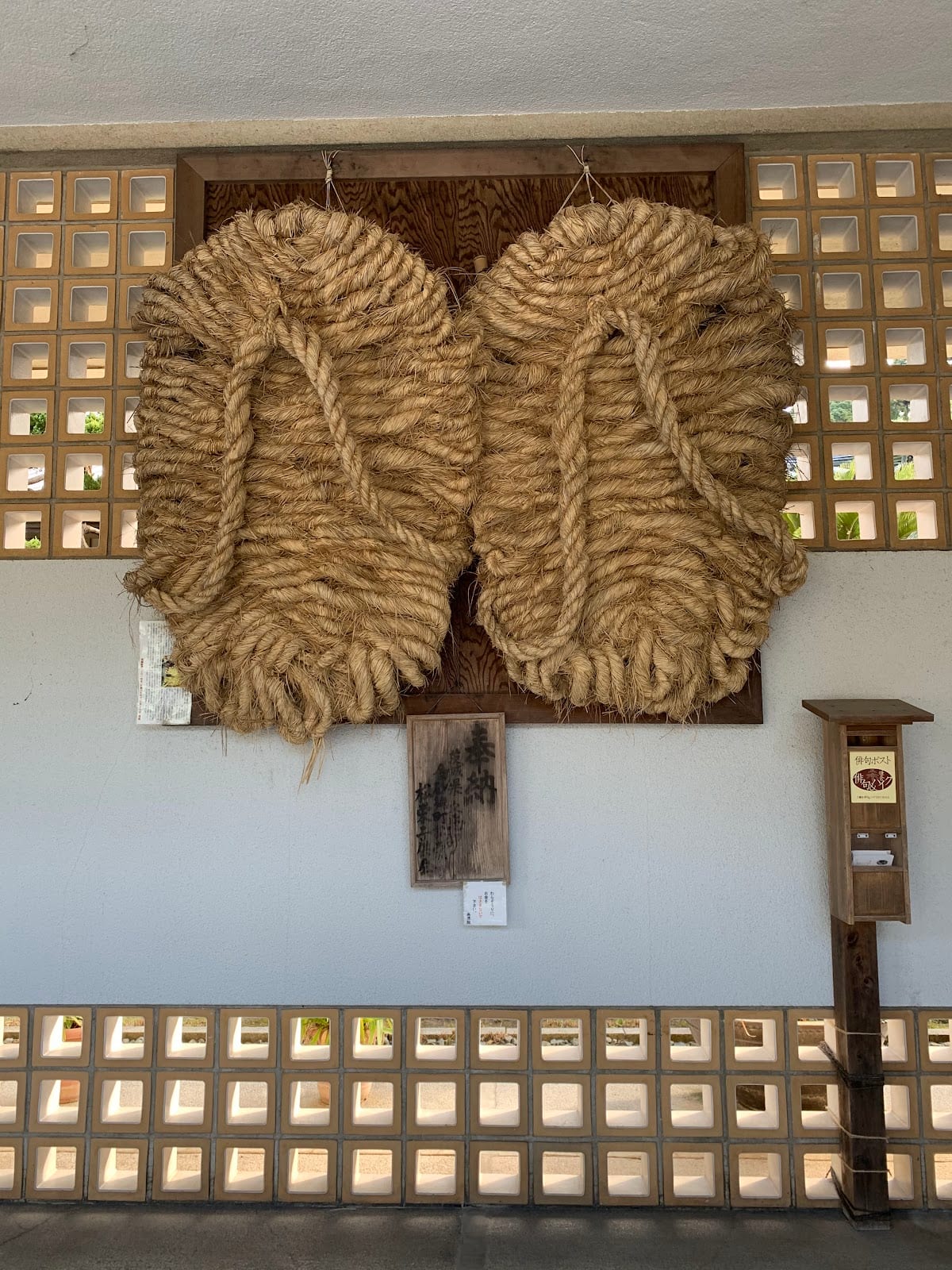 The giant woven straw sandals hung on a wall beside the Great Buddha at Kotoku-in.