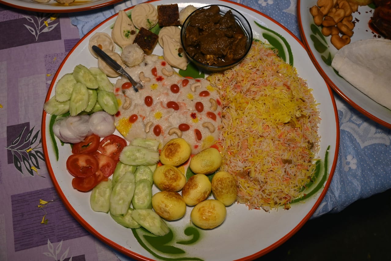 A table topped with plates of food on top of a table