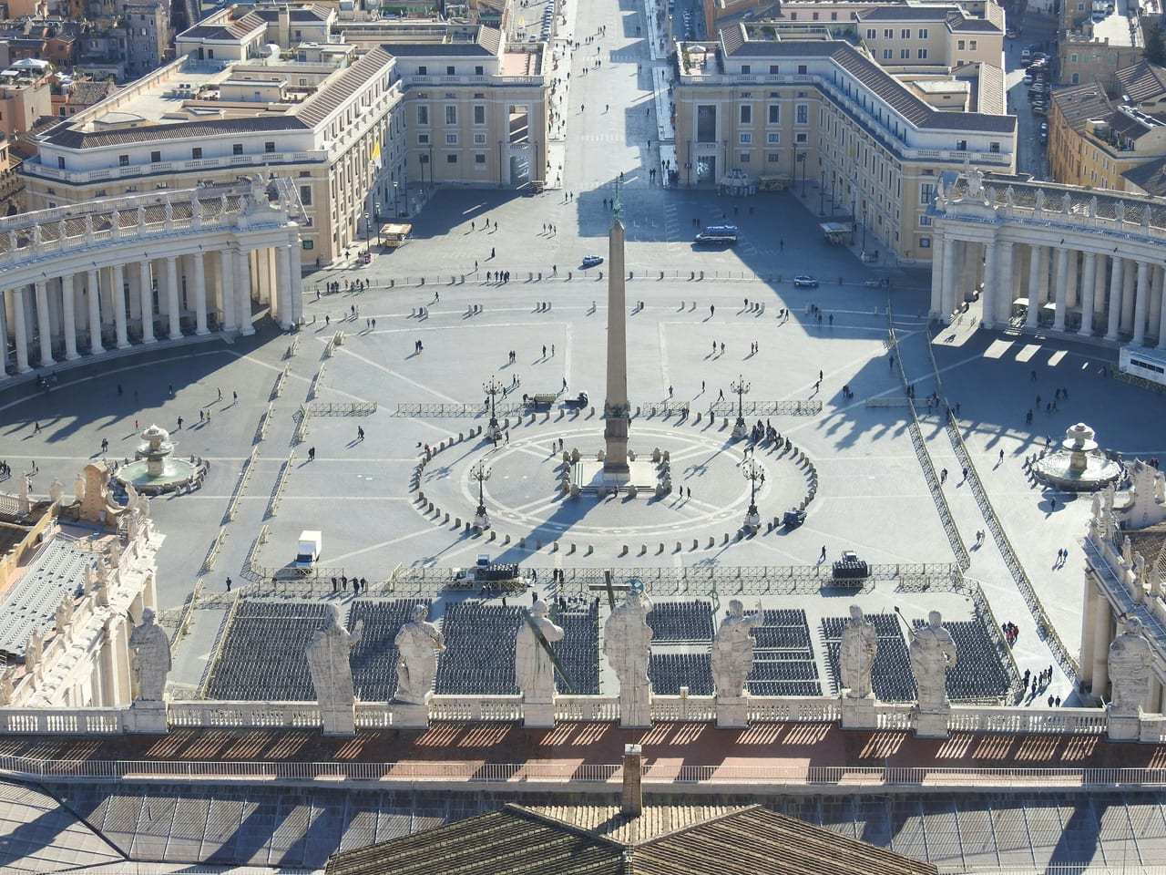 Bernini's colonnade sweeps around the obelisk and the vast ellipse of St Peter's Square, seen from above.