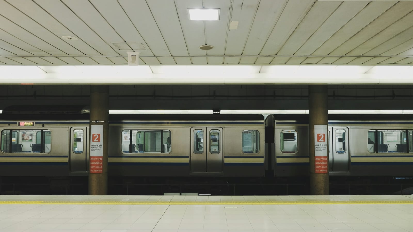 A subway train at a Tokyo station platform.
