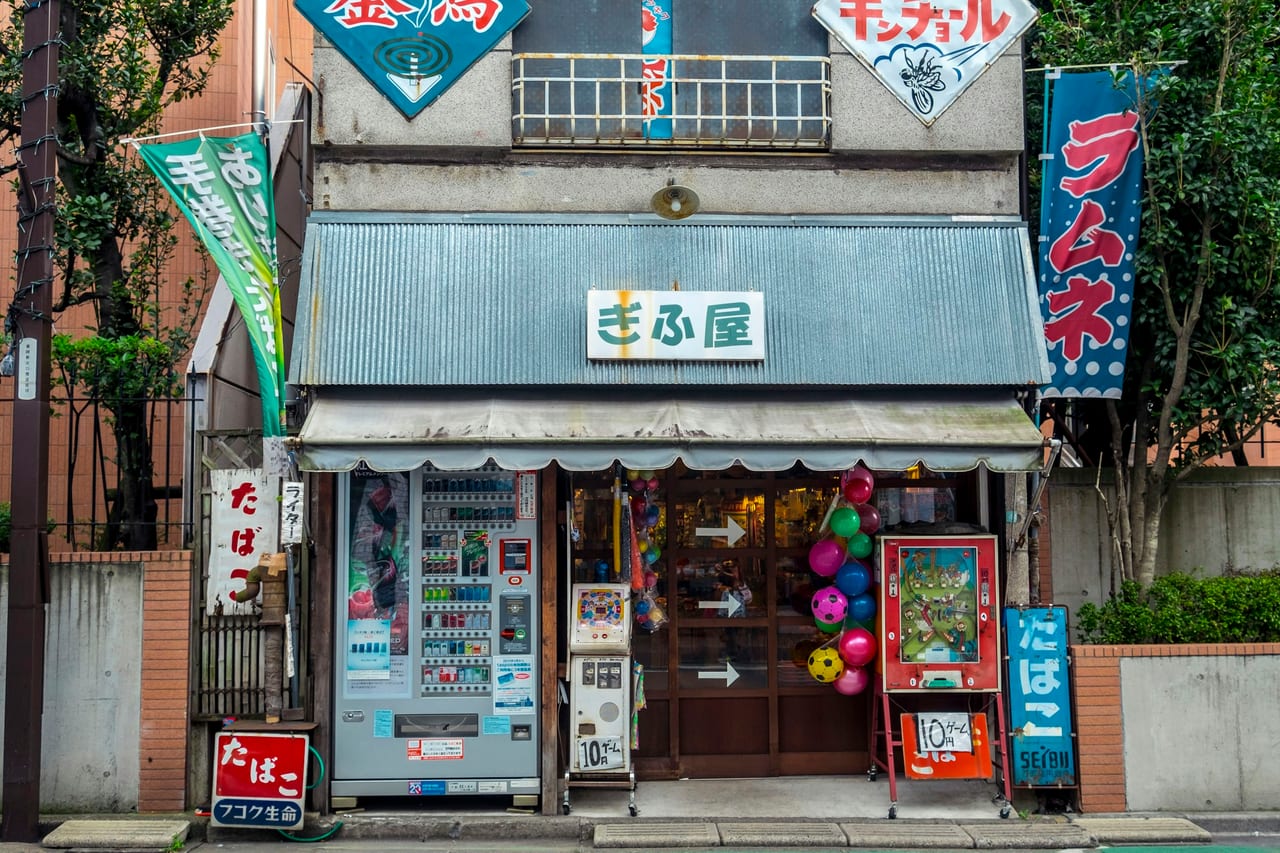 A giant chef's-head bust crowns the Niimi building at the entrance to Kappabashi, Tokyo's kitchen-supply street.