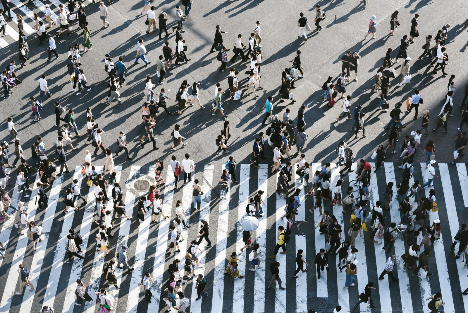 Crowds crossing the Shibuya Scramble.