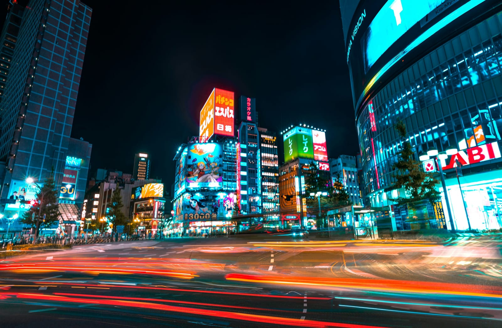 Shinjuku crossing with light trails at night