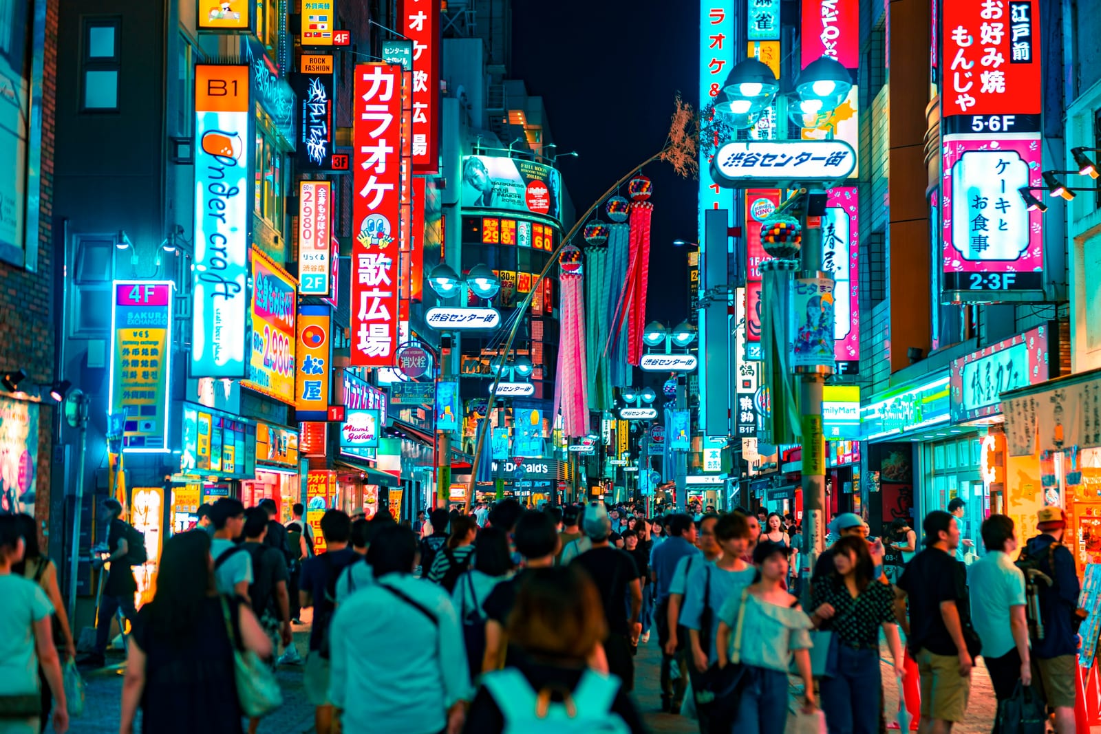 A busy Shibuya shopping street in the evening