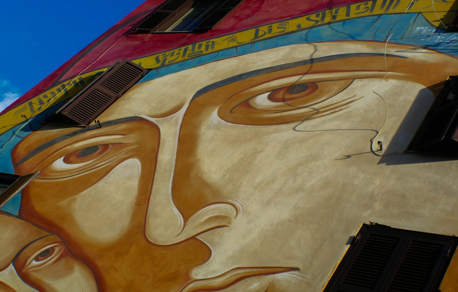A building-sized street-art mural in the San Lorenzo quarter of Rome.