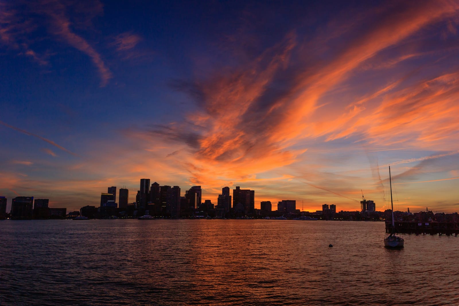 Boston Seaport waterfront skyline at sunset