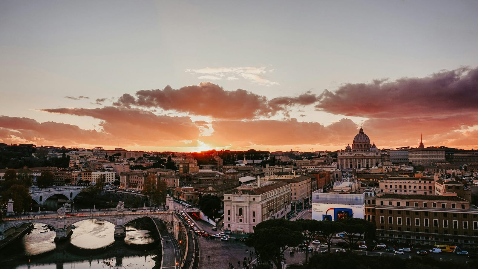 The ochre rooftops of central Rome glowing at dusk.