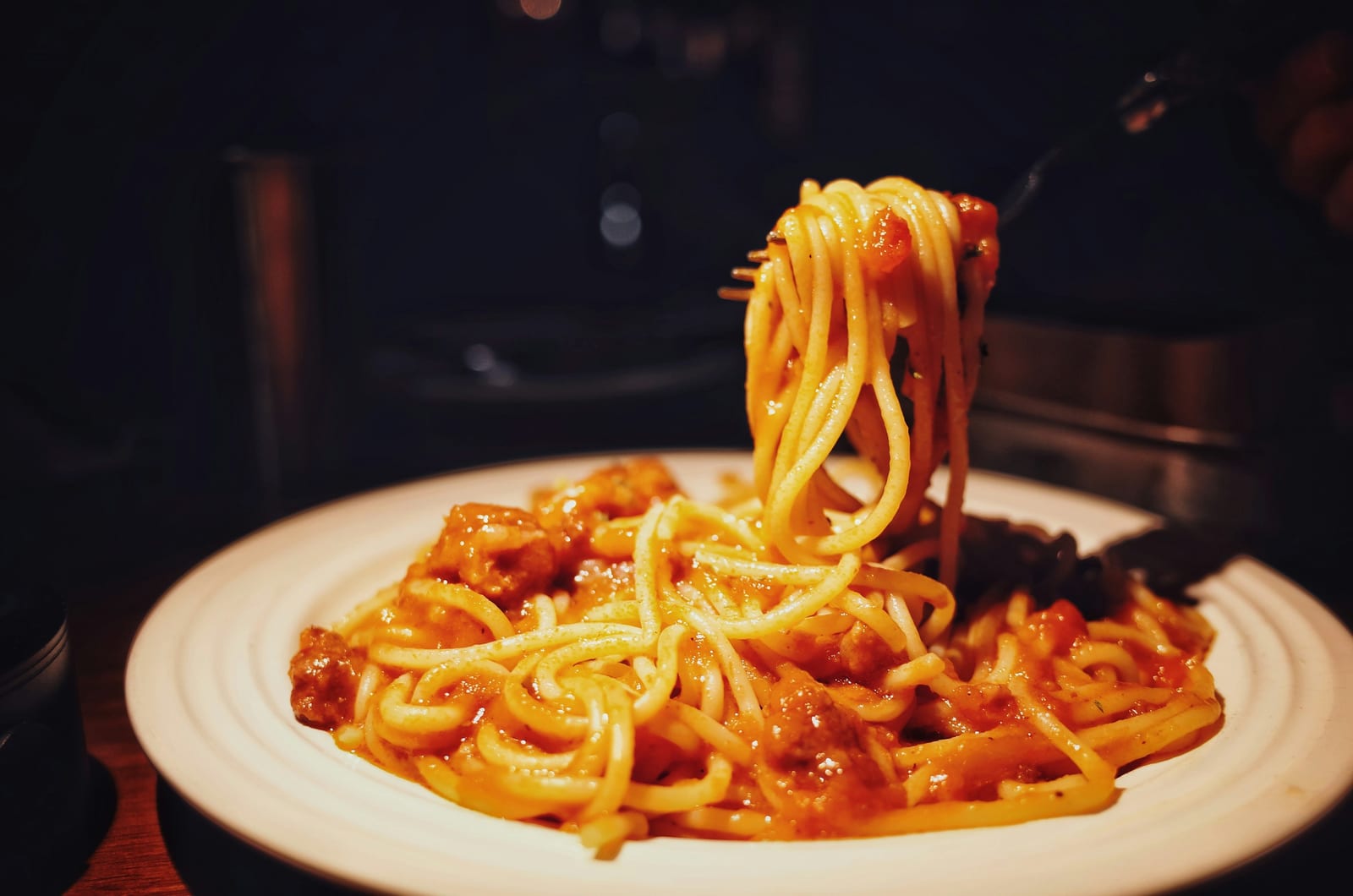 A plate of bucatini in a red tomato and guanciale sauce, the Roman amatriciana.